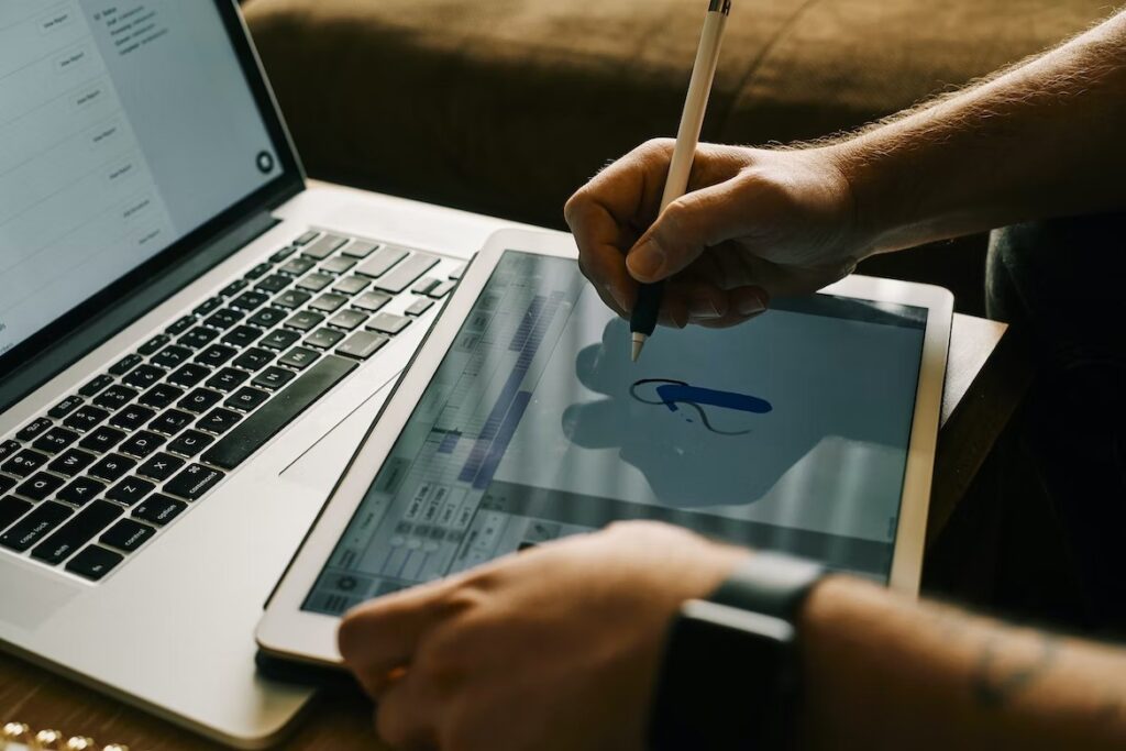 A person drawing on their device