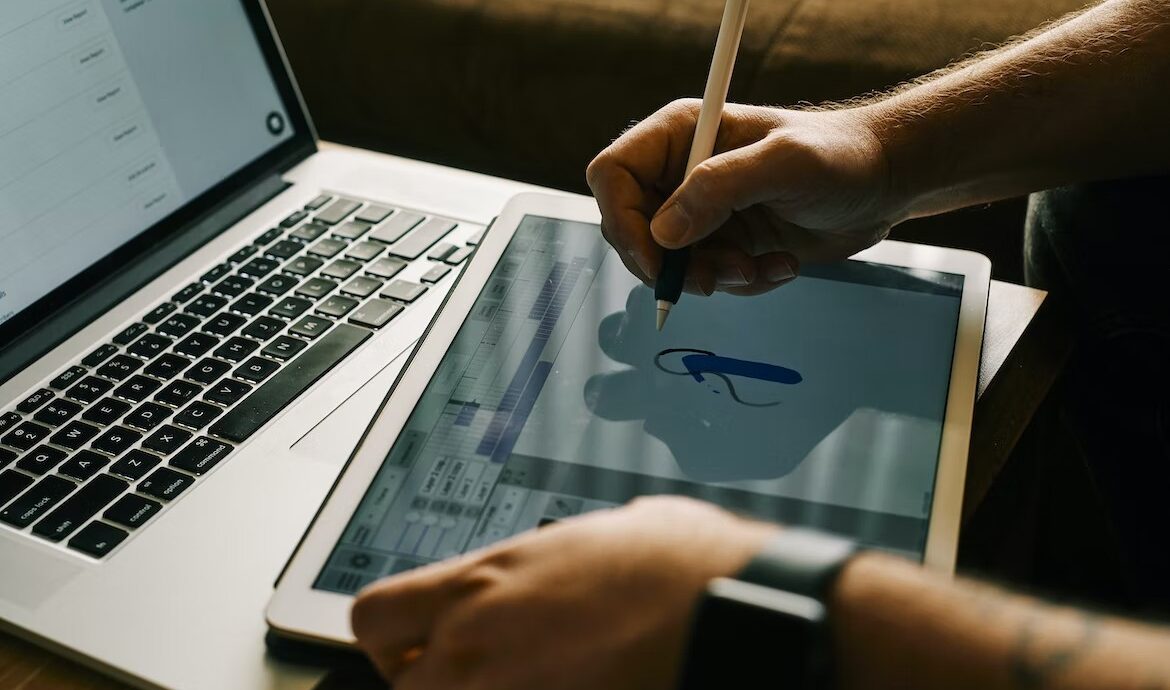 A person drawing on their device